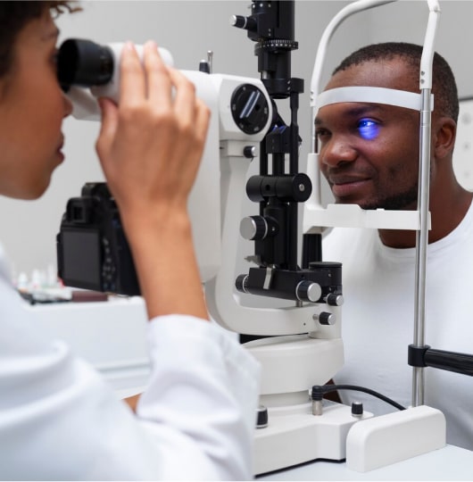 Female ophthalmologist performing an eye test on a patient.