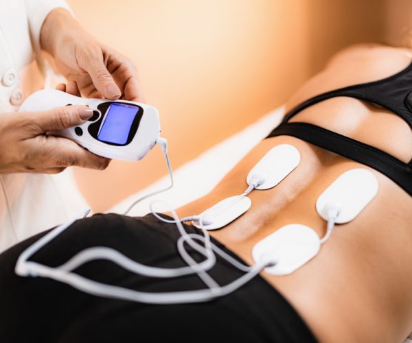 Transcutaneous Electrical Nerve Stimulation (TENS) Lower back physical therapy with TENS electrode pads