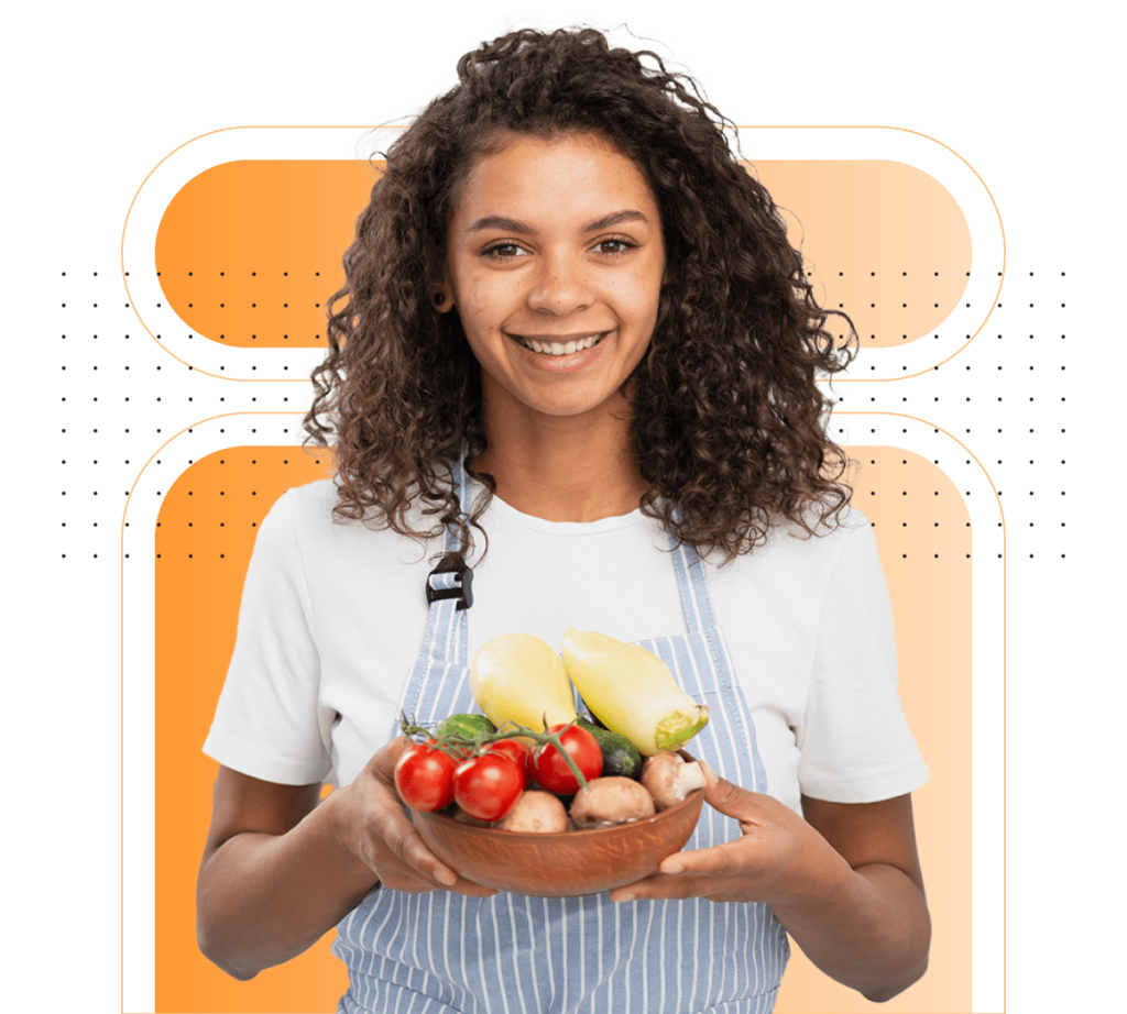 Friendly woman holding a bowl filled with fresh vegetables.