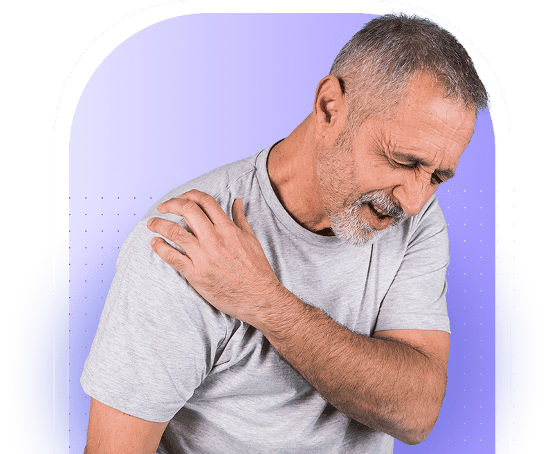 Older man touching his shoulder due to discomfort.